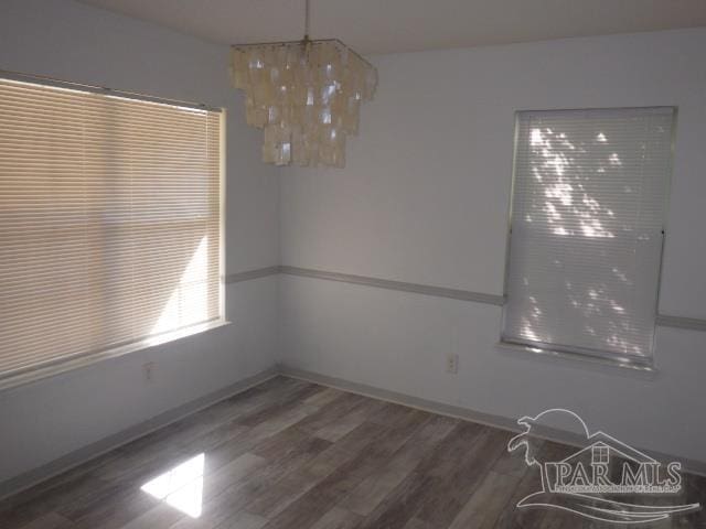 unfurnished dining area with dark hardwood / wood-style floors