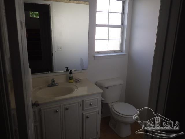 bathroom featuring vanity and toilet