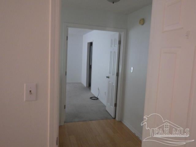 corridor featuring light hardwood / wood-style floors