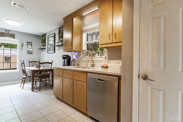 2661 Avenida De Sol, Navarre, FL 32566 - kitchen featuring stainless steel dishwasher, light tile patterned flooring, and a textured ceiling