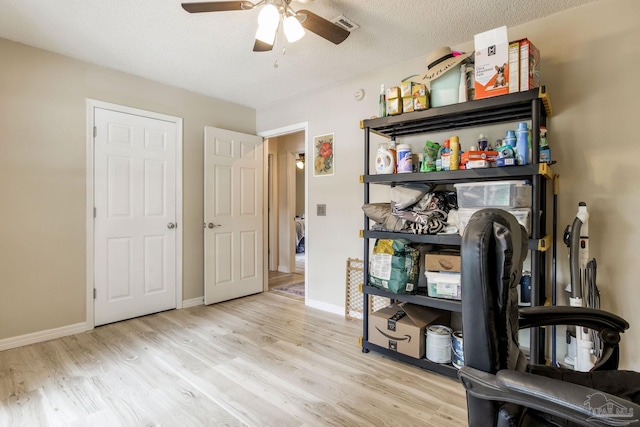 2661 Avenida De Sol, Navarre, FL 32566 - interior space with wood finished floors, ceiling fan, and a textured ceiling