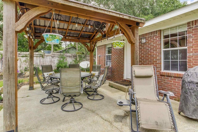 2661 Avenida De Sol, Navarre, FL 32566 - view of patio featuring a gazebo, outdoor dining space, and area for grilling
