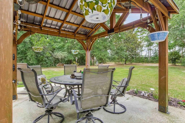 2661 Avenida De Sol, Navarre, FL 32566 - view of patio featuring a gazebo and outdoor dining space