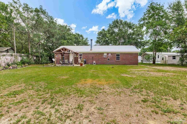 2661 Avenida De Sol, Navarre, FL 32566 - back of house featuring a patio and brick siding