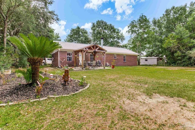 2661 Avenida De Sol, Navarre, FL 32566 - rear view of house featuring a lawn, a patio, and brick siding