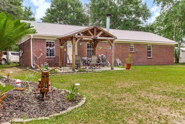 2661 Avenida De Sol, Navarre, FL 32566 - rear view of house featuring a gazebo, brick siding, a lawn, and a patio area