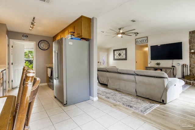 2661 Avenida De Sol, Navarre, FL 32566 - living area featuring ceiling fan, vaulted ceiling, and light tile patterned flooring