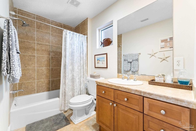 bathroom with visible vents, toilet, shower / bath combo, vanity, and tile patterned floors