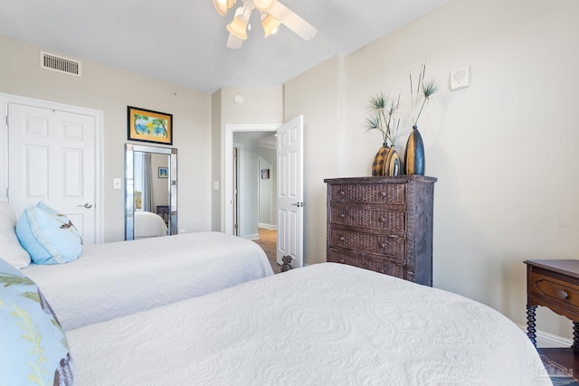 bedroom featuring visible vents and a ceiling fan