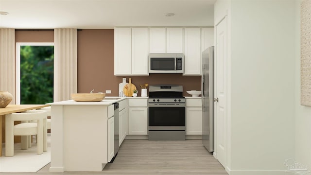 4766 Runway Dr Lot 16G, Pace, FL 32571 - kitchen with light wood-type flooring, light countertops, white cabinets, a peninsula, and stainless steel appliances
