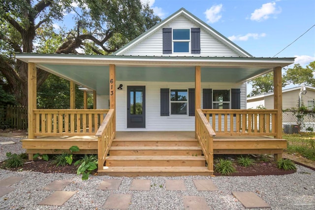 view of front of home featuring central air condition unit and a porch