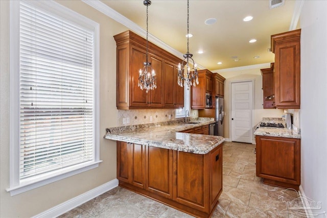 kitchen with crown molding, a peninsula, a sink, and brown cabinets