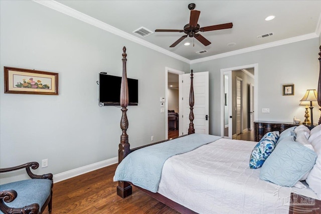 bedroom featuring crown molding, wood finished floors, visible vents, and baseboards