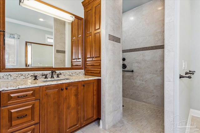 bathroom with ornamental molding, a walk in shower, and vanity