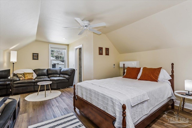 bedroom featuring lofted ceiling, ceiling fan, and wood finished floors