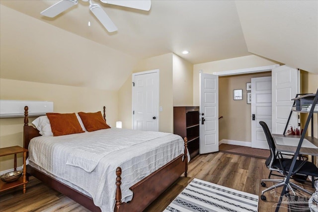 bedroom featuring lofted ceiling, recessed lighting, ceiling fan, wood finished floors, and baseboards