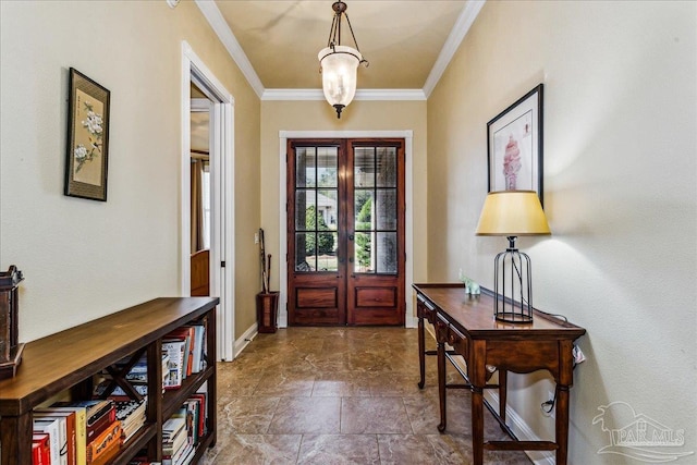 foyer entrance with ornamental molding, stone finish flooring, french doors, and baseboards