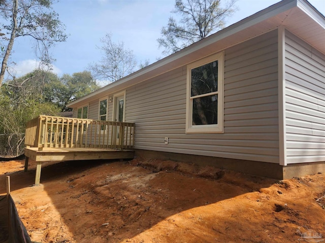 1581 Kyle Dr, Pensacola, FL 32505 - view of side of home with a wooden deck