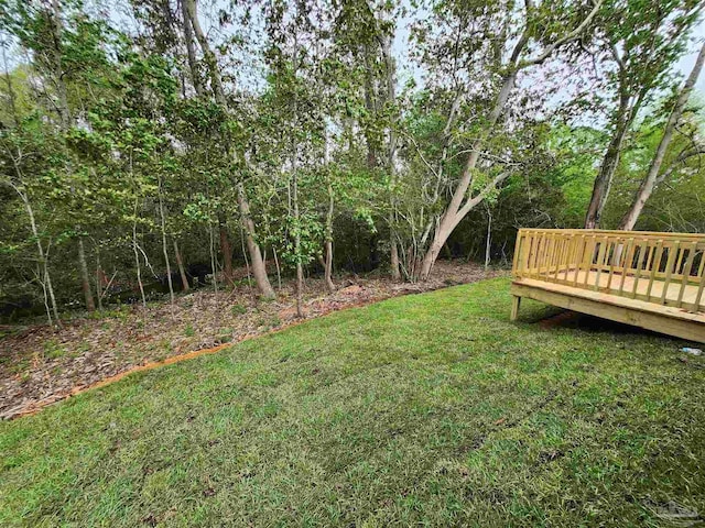 1581 Kyle Dr, Pensacola, FL 32505 - view of grassy yard with a wooden deck