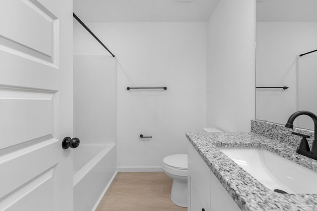 1581 Kyle Dr, Pensacola, FL 32505 - full bathroom featuring vanity, toilet, shower / washtub combination, wood finished floors, and baseboards