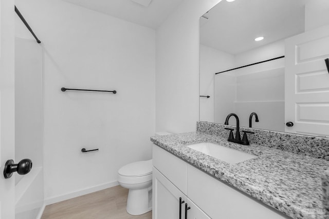 1581 Kyle Dr, Pensacola, FL 32505 - full bath with vanity, wood finished floors, toilet, baseboards, and a shower