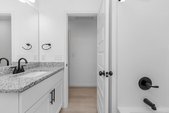 1581 Kyle Dr, Pensacola, FL 32505 - bathroom featuring vanity, wood finished floors, and baseboards