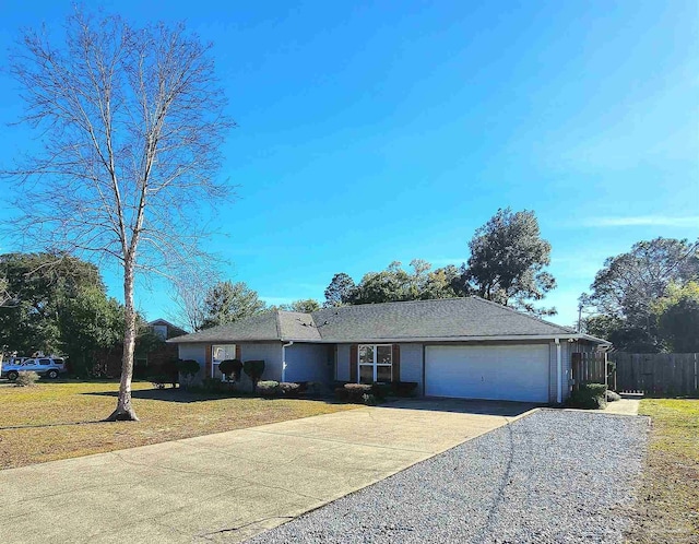 ranch-style home featuring a front yard and a garage