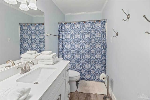 bathroom with crown molding, hardwood / wood-style floors, walk in shower, toilet, and vanity