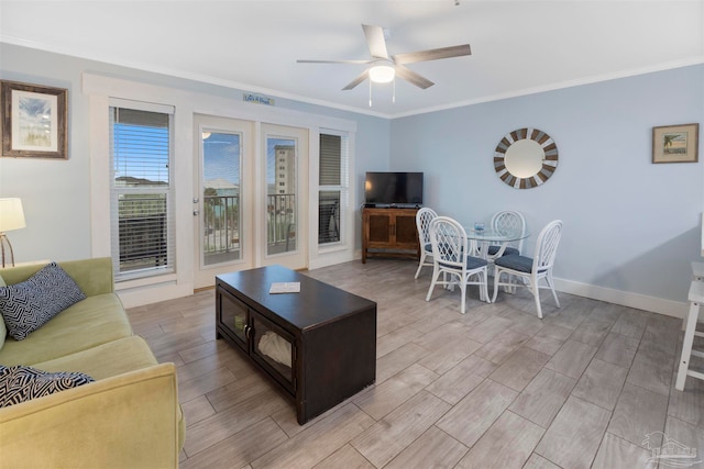 living room with ceiling fan, ornamental molding, and light hardwood / wood-style flooring