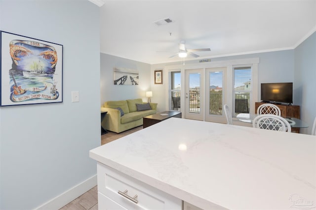 bedroom featuring crown molding, light hardwood / wood-style flooring, ceiling fan, and access to outside