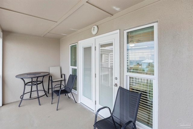 balcony with french doors and a patio area