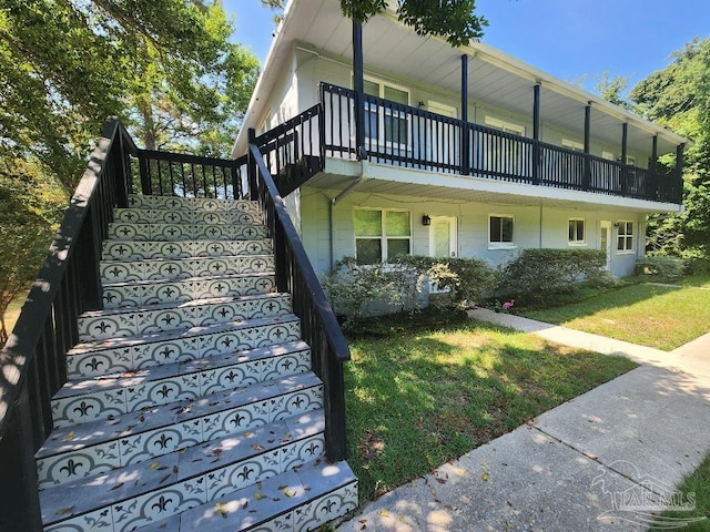729 Lownde Ave, Pensacola, FL 32507 - view of front of home with stairway and a front lawn