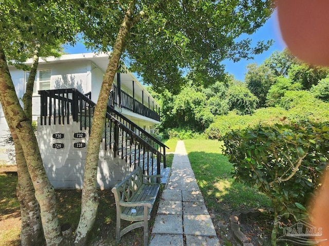 729 Lownde Ave, Pensacola, FL 32507 - view of grassy yard featuring stairway