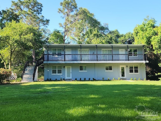 729 Lownde Ave, Pensacola, FL 32507 - back of house featuring stairway and a yard