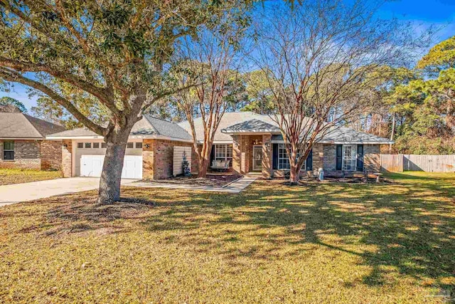 ranch-style house featuring a front yard and a garage