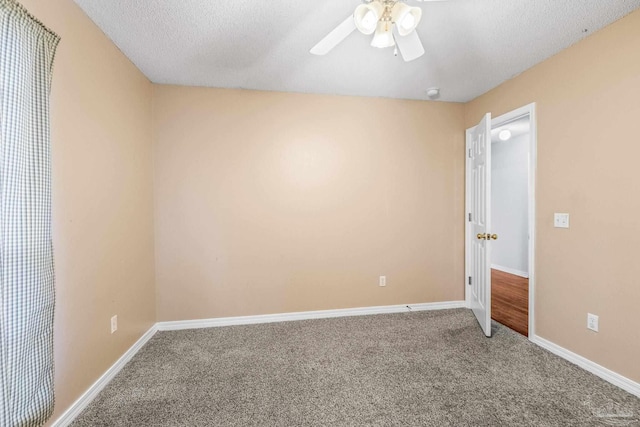 unfurnished bedroom with carpet flooring, ceiling fan, and a textured ceiling