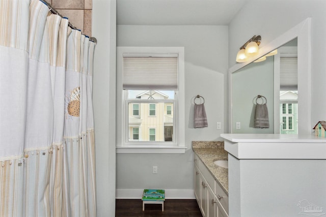 bathroom featuring vanity and wood-type flooring