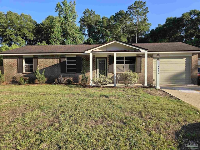 4285 W Avenida De Golf, Pace, FL 32571 - ranch-style home featuring brick siding, a front yard, and concrete driveway