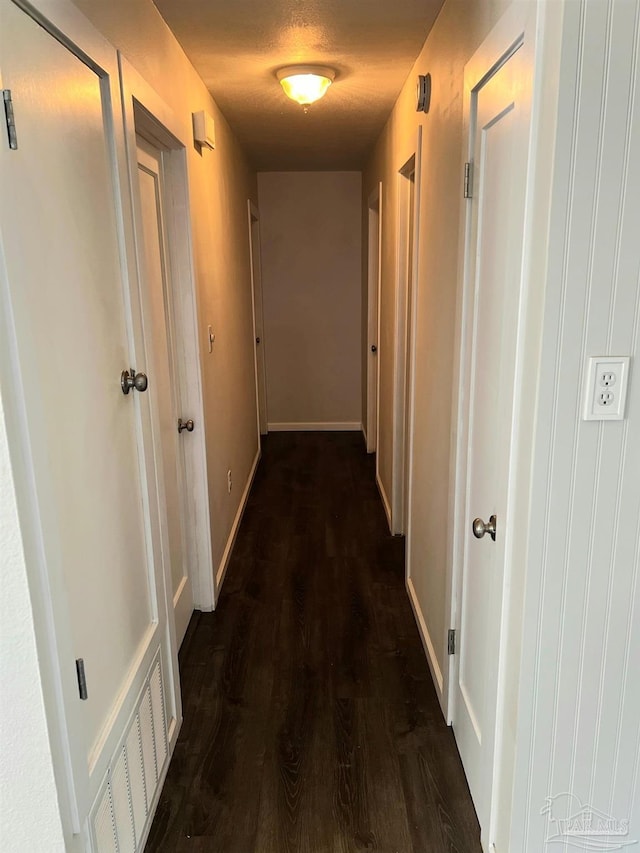 4285 W Avenida De Golf, Pace, FL 32571 - hall featuring dark wood-style floors and baseboards
