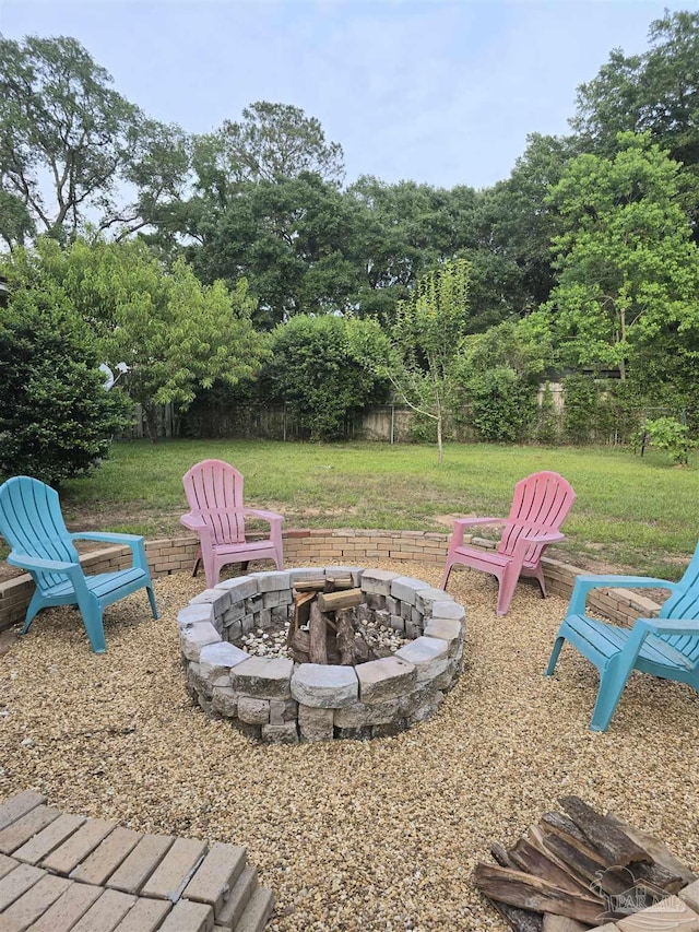 4285 W Avenida De Golf, Pace, FL 32571 - view of green lawn with a fire pit