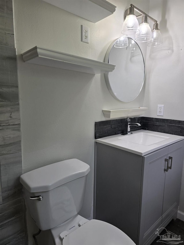 4285 W Avenida De Golf, Pace, FL 32571 - half bathroom with toilet, vanity, and a textured wall