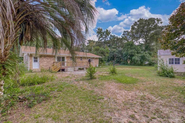 view of yard featuring a wooden deck