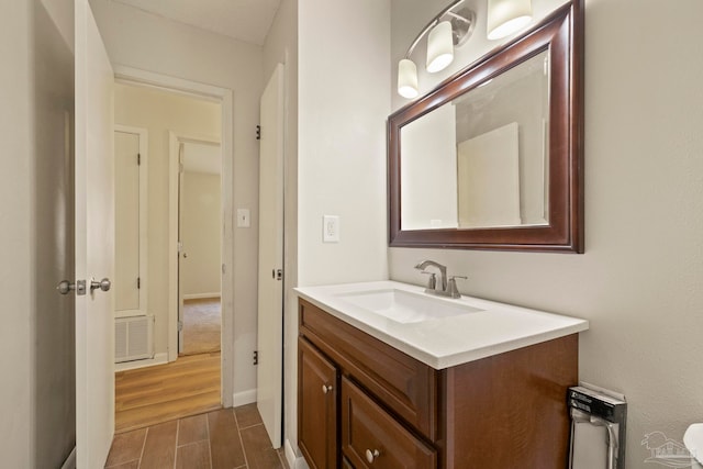 bathroom with wood-type flooring and vanity