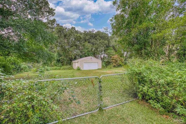 view of yard with an outbuilding and a garage