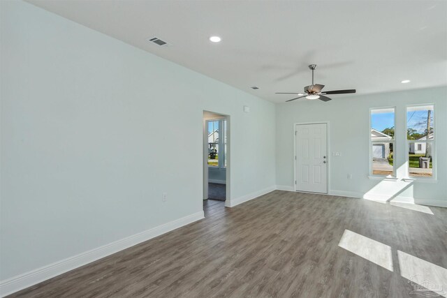 empty room featuring ceiling fan and hardwood / wood-style flooring