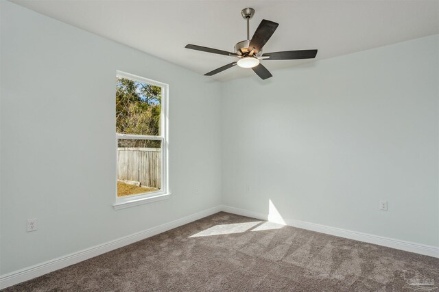 spare room with carpet floors and ceiling fan