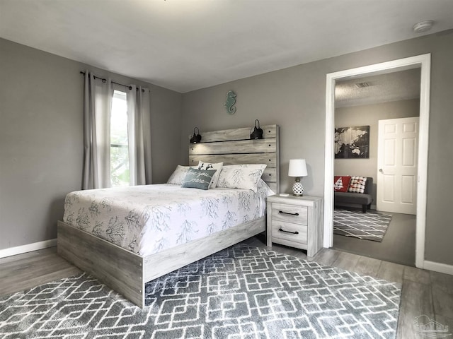 bedroom featuring dark hardwood / wood-style floors