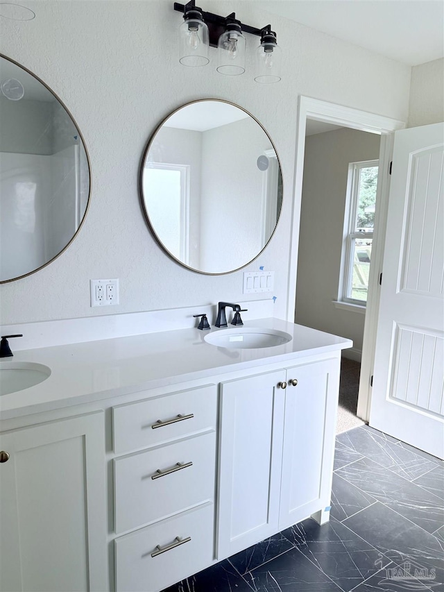 7919 Twin Lake Dr, Milton, FL 32583 - bathroom featuring marble finish flooring and double vanity