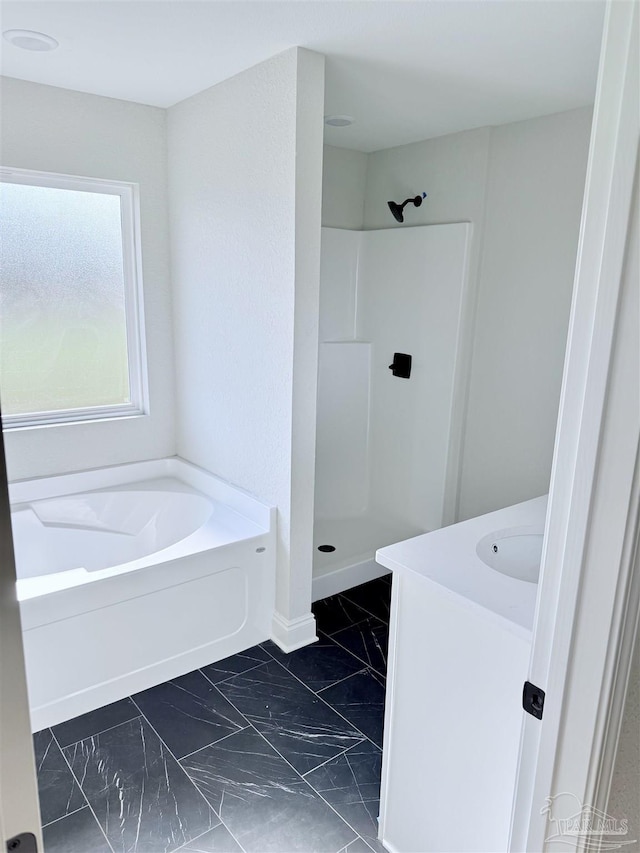 7919 Twin Lake Dr, Milton, FL 32583 - full bath with marble finish floors, a bath, vanity, and walk in shower