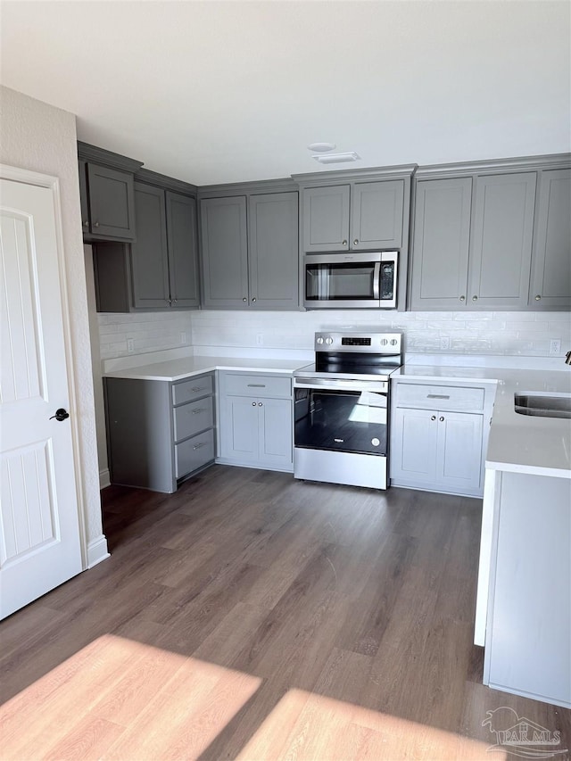 7919 Twin Lake Dr, Milton, FL 32583 - kitchen featuring appliances with stainless steel finishes, gray cabinets, and a sink